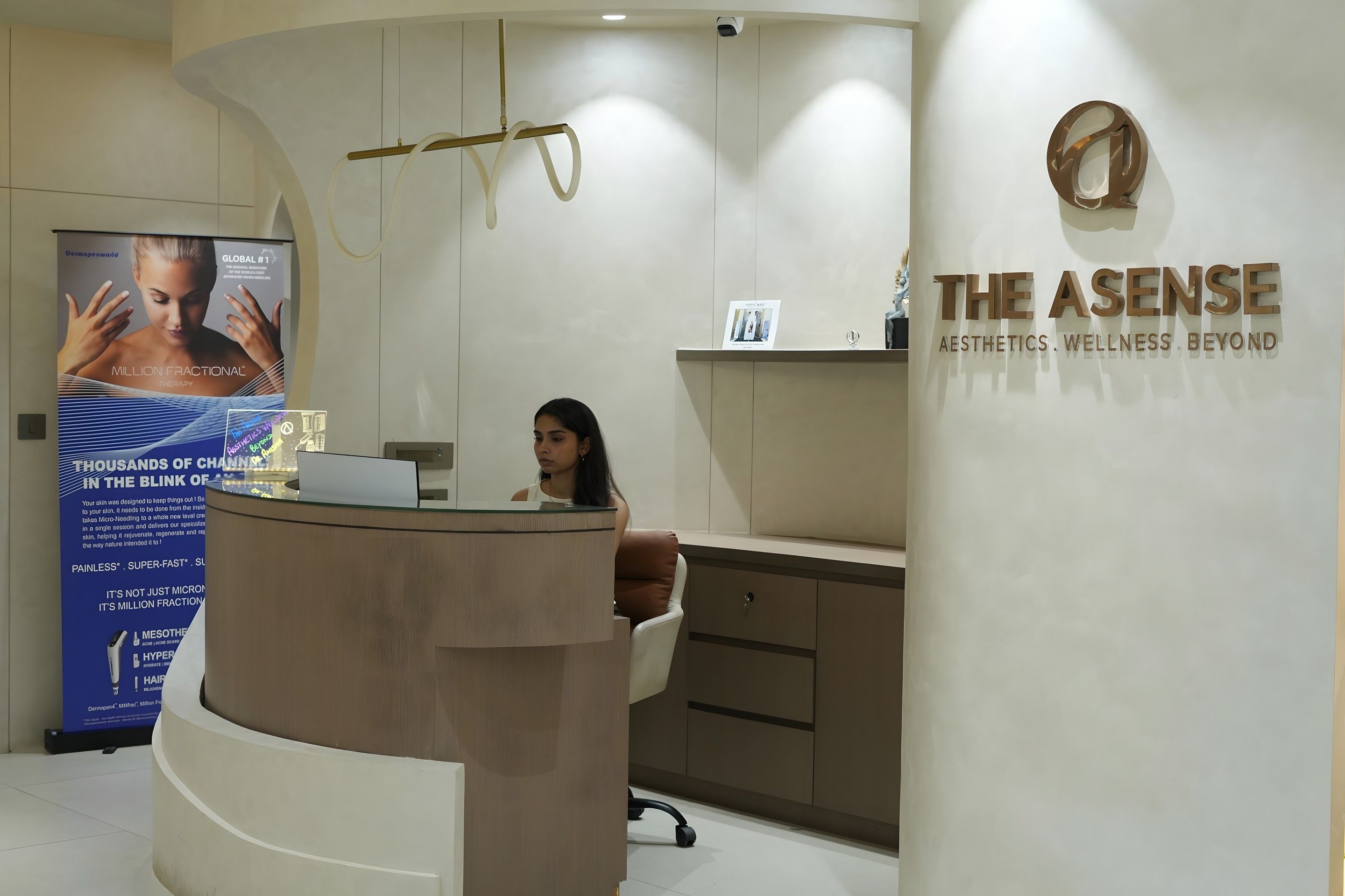 Reception at The Asense clinic in Punjabi Bagh, Delhi, with the Aesthetics. Wellness. Beyond. signage